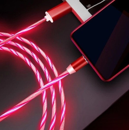 A close-up of a red braided charging cable connected to a smartphone, with the cable glowing pink and red against a dark background.