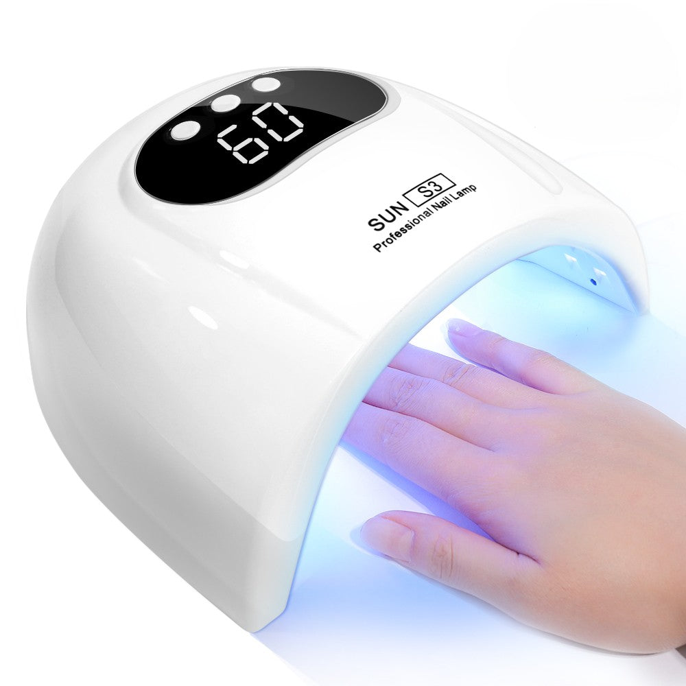 White UV LED gel nail lamp with a digital display showing 60 minutes and a hand inside the lamp emitting blue light, on a white background.