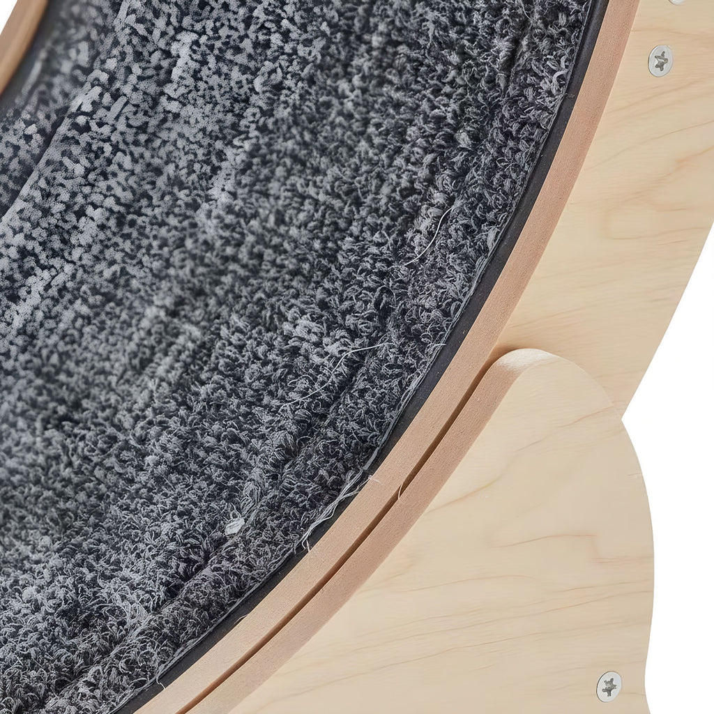 Close-up of the gray carpet running track inside the wooden cat wheel