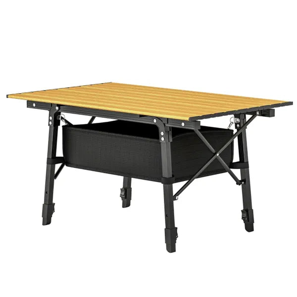 Folding camping table with brown tabletop, black frame and storage basket on a white background