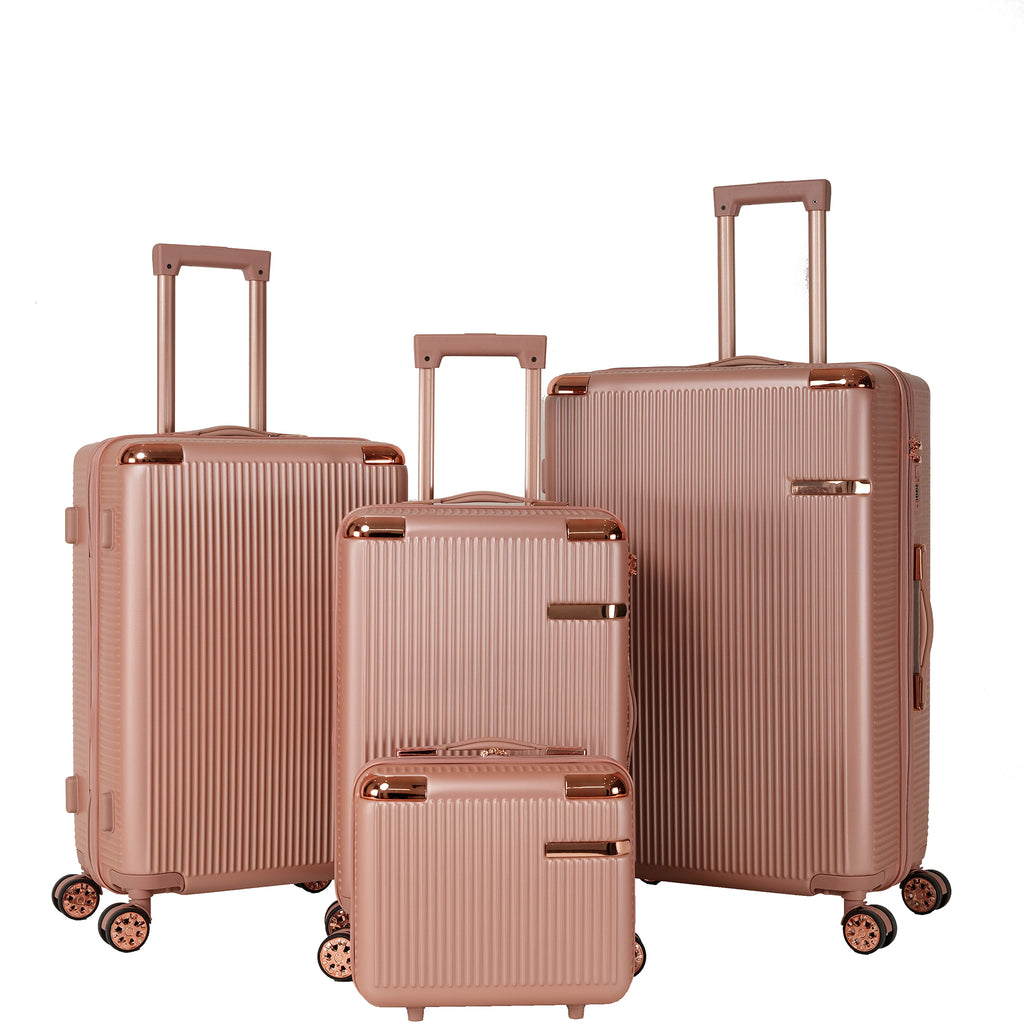 Rose gold 4-piece hard shell luggage set with vanity case and three spinner suitcases on a white background